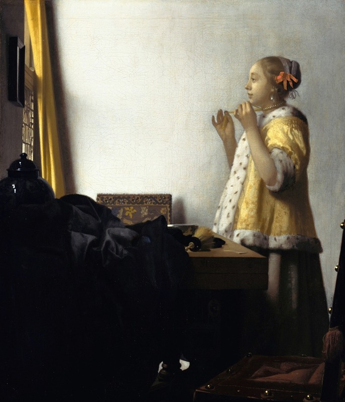 Jonge vrouw met een parelketting - Johannes Vermeer